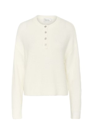 Bijela pletena pula s okruglim izrezom i tri dekorativna gumba. Ima rebraste rukave i obrub, što pruža mekanu teksturu.