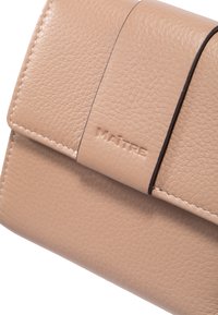 Beige leather wallet featuring a textured surface, a folded design, and embossed lettering. Contrasting stitching runs along the edges.