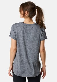 Gray athletic t-shirt with short sleeves, round neckline, and a slightly curved hem. Fabric appears breathable with a subtle texture.