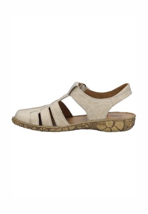 Sandale en cuir beige à bout fermé avec plusieurs brides, bride à la cheville et semelle texturée à motifs floraux.