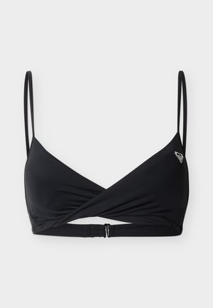 Zwarte bralette met dunne dubbele bandjes, een gedraaide voorkant en een klein hartvormig logo op de linker cup.