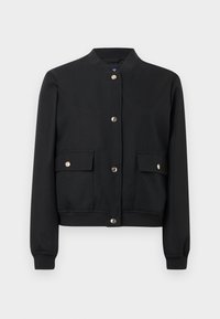 Geacă bomber neagră din material neted, cu nasturi capsa în față, două buzunare frontale și manșete și tiv plisate.