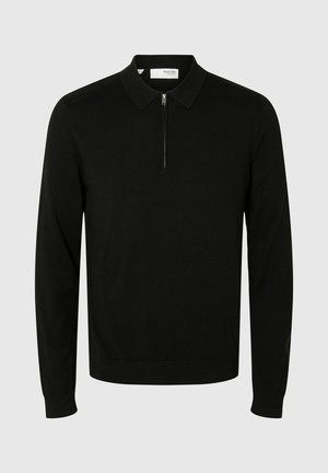 Schwarzer langärmeliger Poloshirt-Pullover aus gestricktem Stoff. Verfügt über einen Kragen und einen halben Reißverschluss an der Vorderseite, mit einer taillierten Passform und gerippten Bündchen.