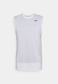 White sleeveless athletic shirt made of lightweight fabric. Features a round neckline and a small black Nike logo on the upper left chest.