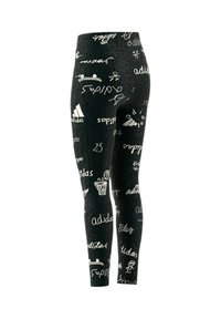 Leggings neri a coste con loghi bianchi Adidas e grafiche giocose, tra cui palloni da basket e figure, in una forma aderente.