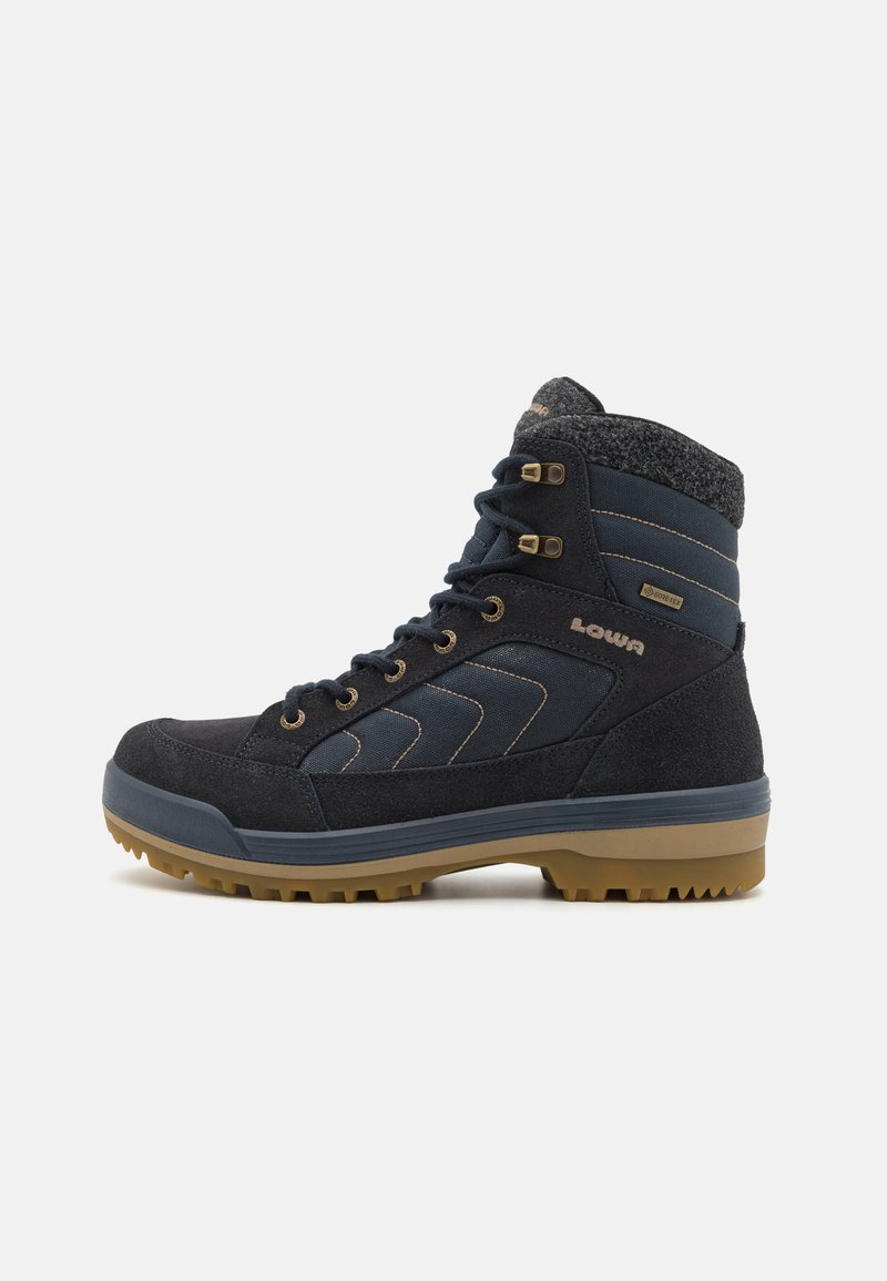 Black and navy hiking boot with a suede and textile upper, a padded collar, rubber sole, and metal eyelets for laces.