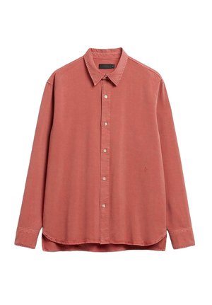 Langærmet knap-op skjorte i støvet rosa bomuld med spids krave, frontplacket og en subtil broderet detalje på brystet.