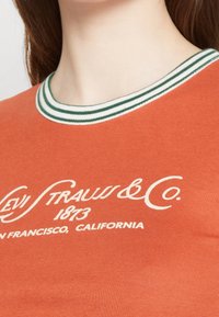 Levi's® T-shirt med print - orange