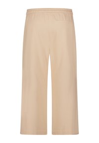 Beige wijde broek van gladde stof, met een elastische tailleband en een achterzak.