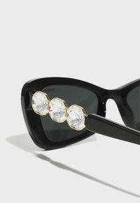 Swarovski Ochelari de soare - black