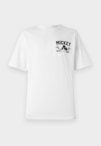 White cotton t-shirt featuring a black graphic with "MICKEY" and a cartoon character, with a round neckline and short sleeves.