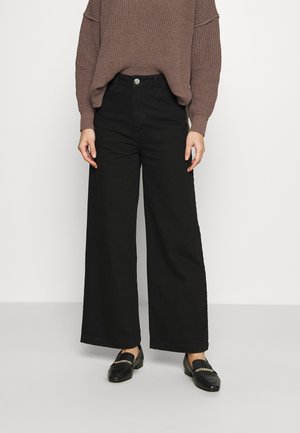 CALM - Flared Jeans - black