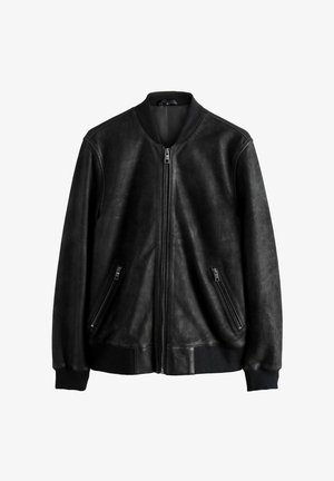 Veste bomber en cuir noir avec fermeture éclair à l'avant, deux poches latérales zippées, poignets et col côtelés, avec une texture lisse et mate.