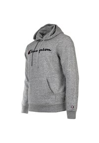 Sivá bavlnená mikina s predným vreckom, kapucňou so sťahovacou šnúrkou a vyšitým logom "Champion" v čiernej a červenej farbe. Rúbkové manžety a spodný lem.