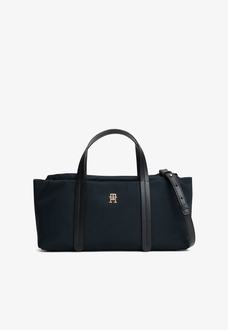 Sac à main rectangulaire noir avec deux poignées courtes, bandoulière réglable et petit logo doré centré sur le panneau avant.