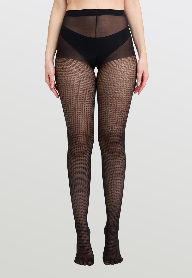 Collant neri trasparenti con un motivo geometrico a trama, design a vita alta e punta aperta. Materiale liscio con una leggera finitura lucida.