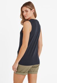 Navy sleeveless top made of soft fabric, featuring a round neckline and a relaxed fit, paired with olive green rolled-cuff shorts.