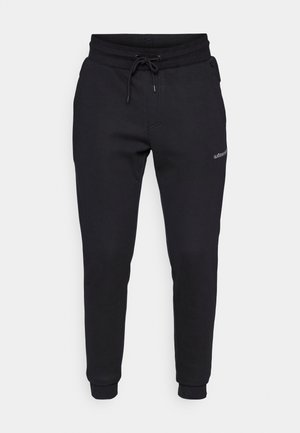 Black slim-fit jogger pants with elastic waistband, drawstring, side pockets, and small logo on upper left thigh.