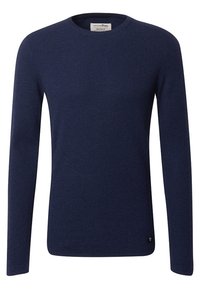 Sweater en tricot bleu marine avec un col rond, des manches longues et un motif texturé. Il présente un petit logo au niveau de l'ourlet.