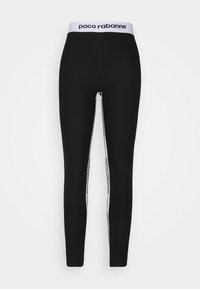 Svarta leggings med en vit logoband och vertikala ränder med texten "paco rabanne" längs sidorna. Slät, elastisk tyg.