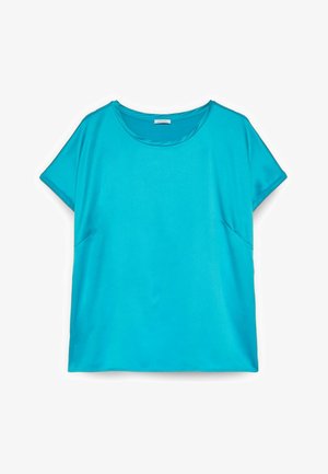 Chemise turquoise vif à manches courtes avec encolure ronde et coupe ample, présentée sur un fond blanc.