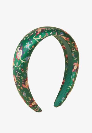 Green padded headband with colorful floral patterns and a smooth fabric finish.