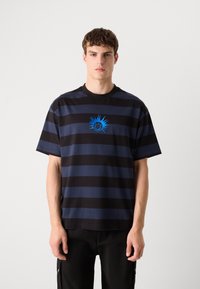 Black and navy striped short-sleeve t-shirt with a round neckline, featuring a blue sun graphic in the center. Smooth cotton fabric texture.