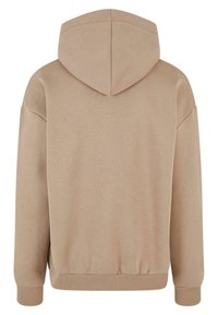 Beige Kapuzenpullover aus der Rückansicht, mit einer verstellbaren Kapuze, gerippten Bündchen und Saum, aus weichem, strukturiertem Stoff gefertigt.