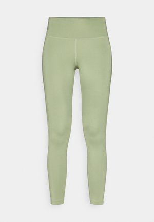 Leggings aderenti in un morbido tessuto verde chiaro con vita alta, superficie liscia e cuciture piatte.