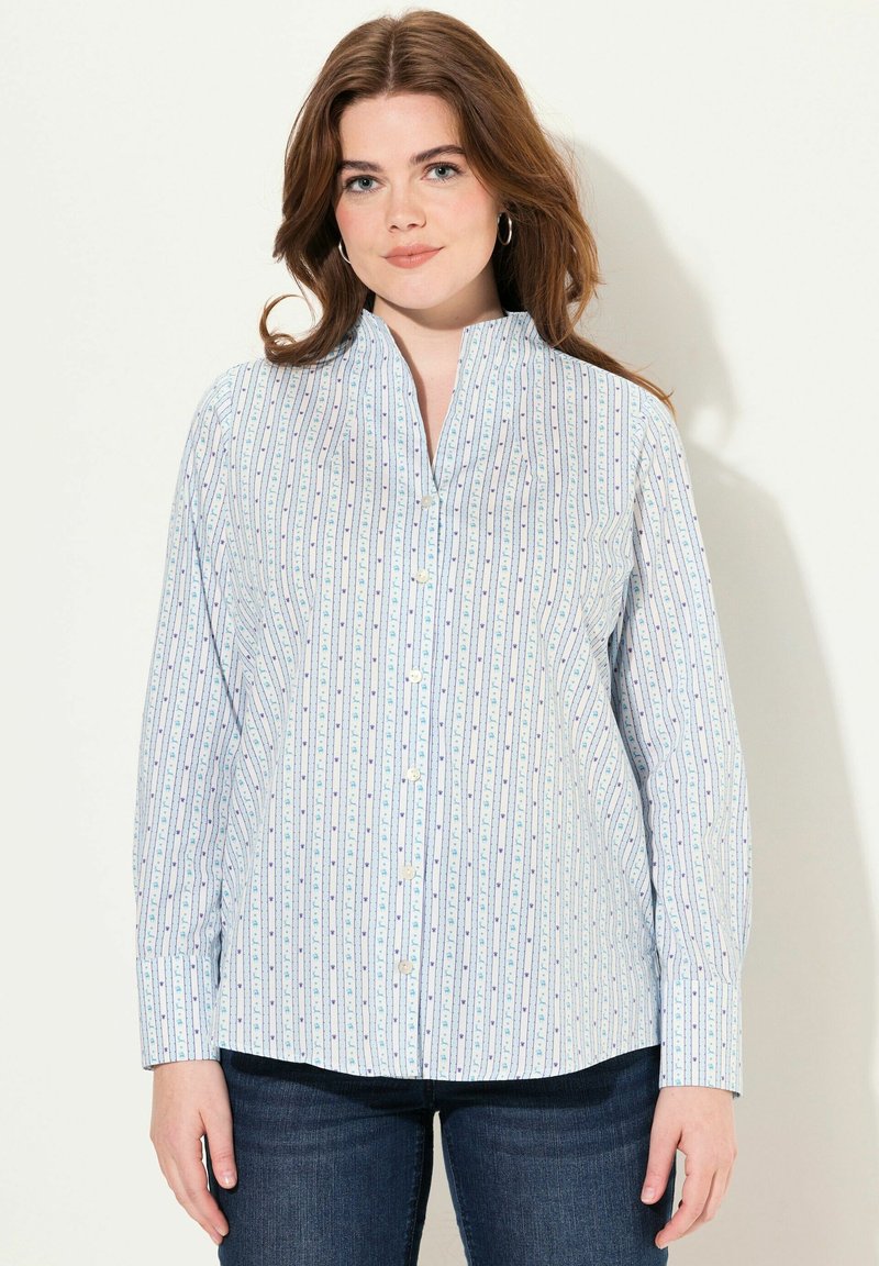 Camisa de botones azul claro con rayas verticales y pequeños patrones florales. Cuenta con cuello mao y mangas largas. Tejido de mezcla de algodón.