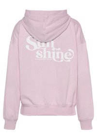 Felpa con cappuccio rosa dal taglio morbido, con una grande grafica in bianco sul retro che recita "Sun shine". Tessuto morbido.