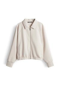 Giacca beige con zip e maniche lunghe, collo, orlo elasticizzato, tasche laterali e polsini a coste, distesa su uno sfondo bianco.
