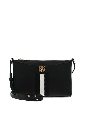Sac bandoulière noir DKNY avec bande verticale blanche, logo doré sur le devant et sangle d'épaule réglable.