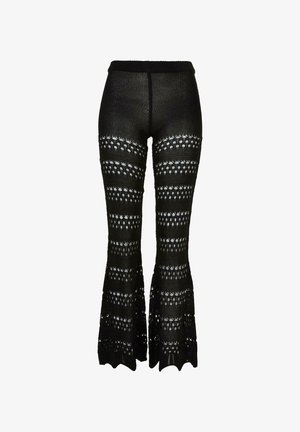 Zwarte gebreide uitlopende broek met afwisselend effen en opengebreide horizontale strepen, met geschulpte zoom.