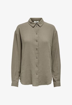 Langermet skjorte i khakigrønt, laget av teksturert stoff. Har krage og knappelukking foran med matchende knapper.