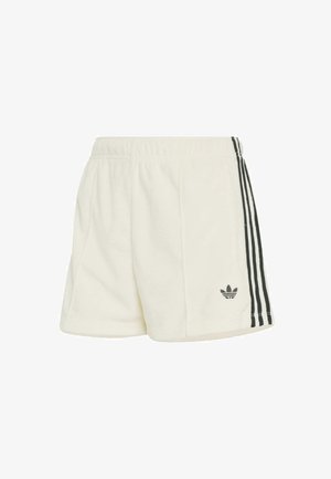 Białe szorty polarowe z czarnymi bocznymi paskami. Elastyczny pas, miękka tekstura i małe czarne logo na dolnej lewej nodze.