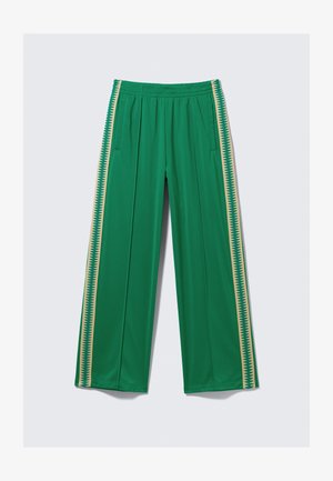 Pantaloni sportivi verdi con vita elasticizzata, dotati di tasche laterali e strisce verticali gialle con motivo a zigzag. Tessuto liscio.