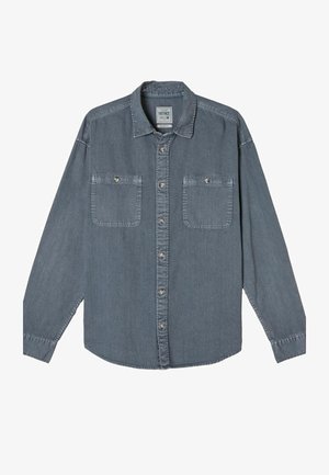 Denim shirt in a medium grey hue with a button-up front, two chest pockets, and a classic collar. Features long sleeves and stitched detailing.