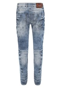 Verbleekte blauwe denim jeans met een slim fit, voorzien van twee achterzakken, decoratieve stiksels en een leren merkembleem op de tailleband.