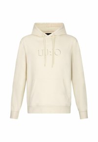 Creme hoodie med en lomme foran, snøre i hætten og præget logo. Fremstillet af blødt stof med ribkant ved ærmerne og kanten.