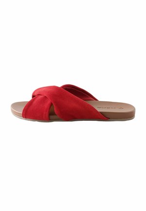 Flat slide sandal with crossed red suede straps and a light brown footbed visible from the side on a white background.