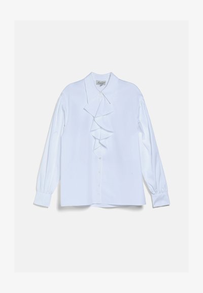 Blouse blanche à manches longues avec détail froncé à l'avant, fermeture par boutons, col pointu et poignets, posée à plat sur un fond clair.