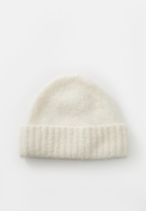 White knitted beanie made of soft wool, featuring a ribbed cuff and smooth, slightly fuzzy surface, designed for warmth and comfort.