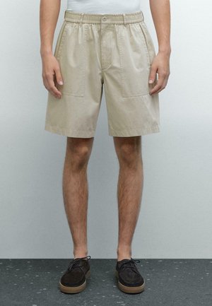 BERMUDA - Shorts - beige