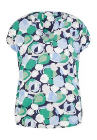 Blouse à manches courtes avec col en V, présentant un motif abstrait en vert, bleu, blanc et bleu marine.
