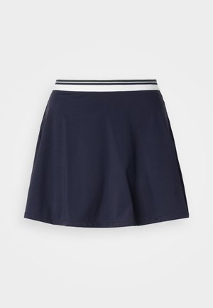 Temno modra A-linijska krilo z elastičnim pasom, na katerem so bele in črne črte, prikazano na preprostem svetlem ozadju.