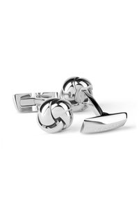 Silver cufflinks featuring a knot design and a rectangular base. The surface is shiny with a smooth texture and engraved branding.