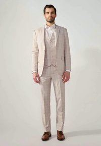 Light gray plaid three-piece suit with a slim fit, featuring a jacket, vest, and trousers, paired with brown leather shoes.