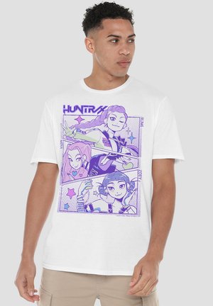 White T-shirt featuring a graphic print with purple illustrations of three characters and stars, displaying a comic-style design.