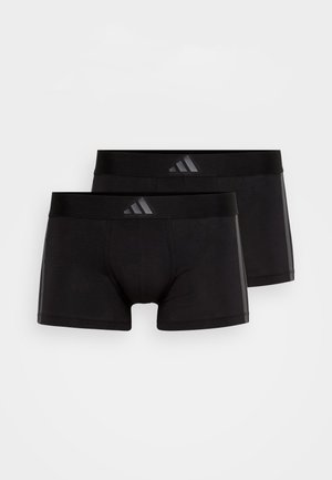 Sorte bomullsboxershorts med en tettsittende design, med en glatt midjebånd og Adidas-logoen i et grått mønster på fremsiden.
